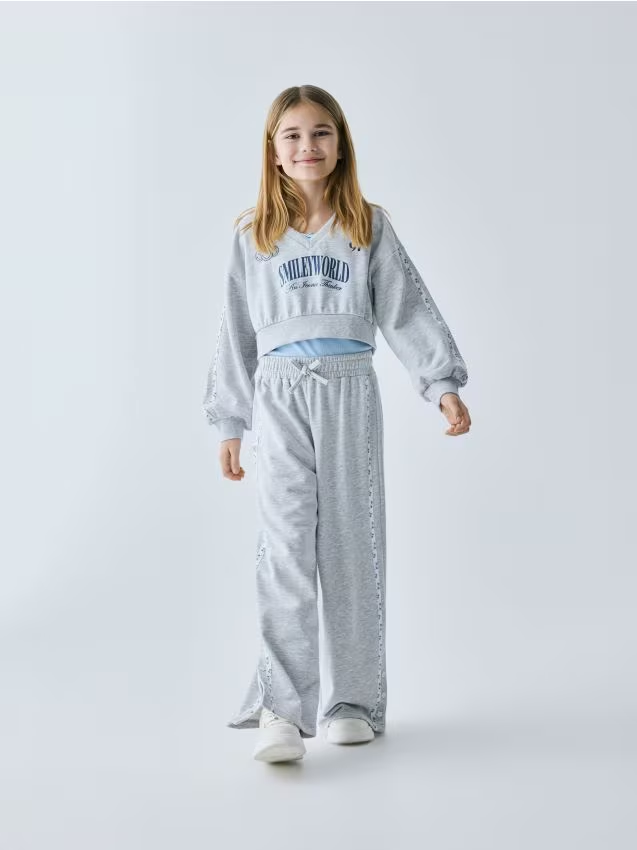 Reserved - Spodnie dresowe SmileyWorld® - jasnoszary