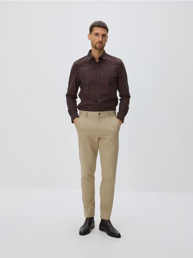 Reserved - Bawełniane spodnie slim fit - beżowy